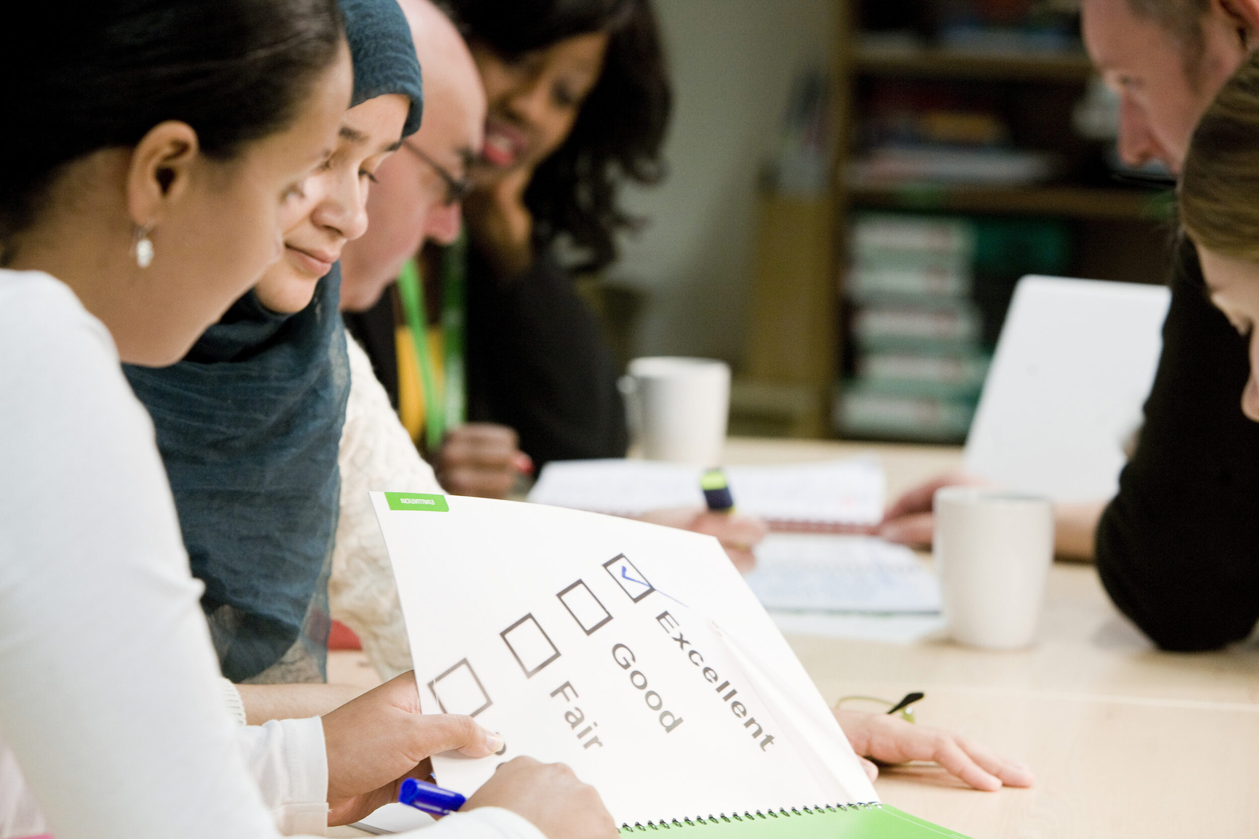 Help for persistently absent children- staff with forms