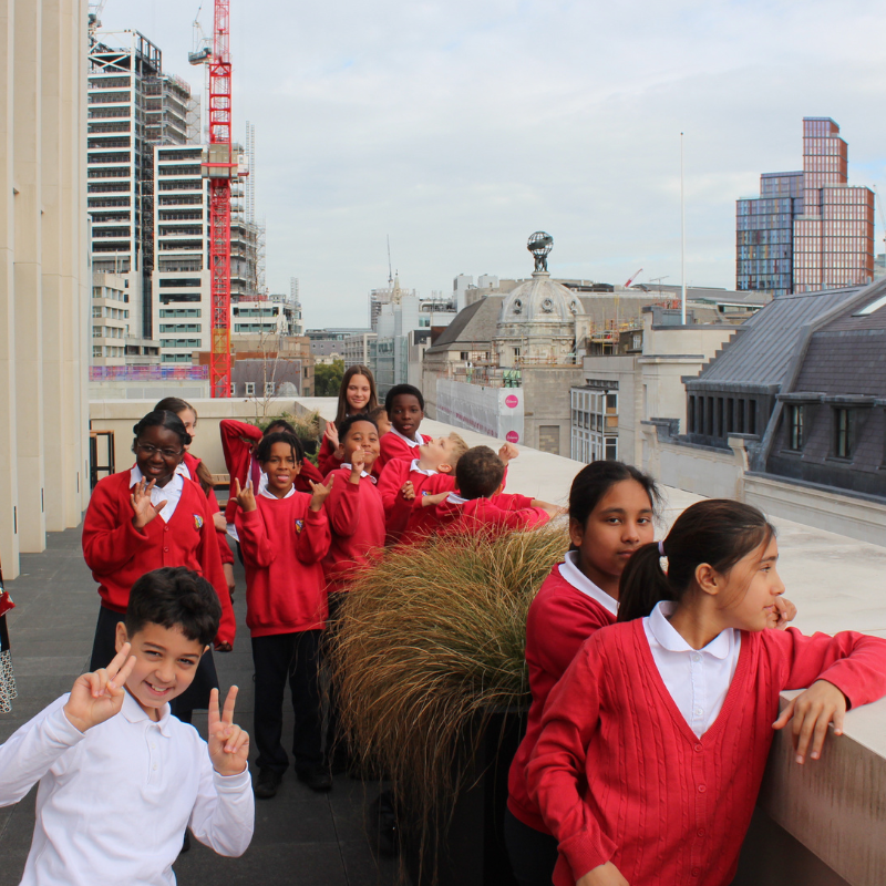 helping disadvantaged students: children in red uniform