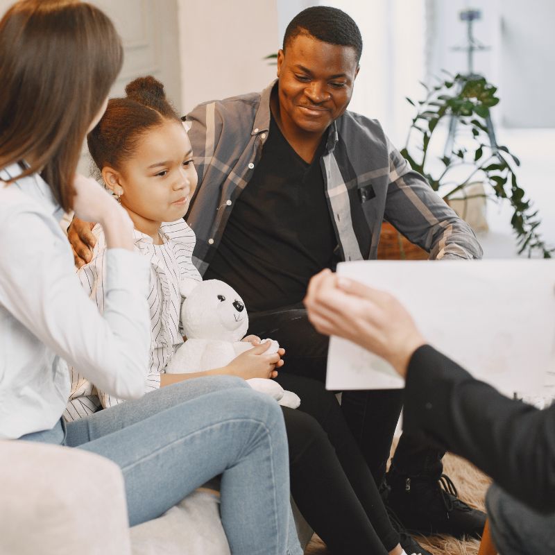 Family sitting on a sofa - user voice week